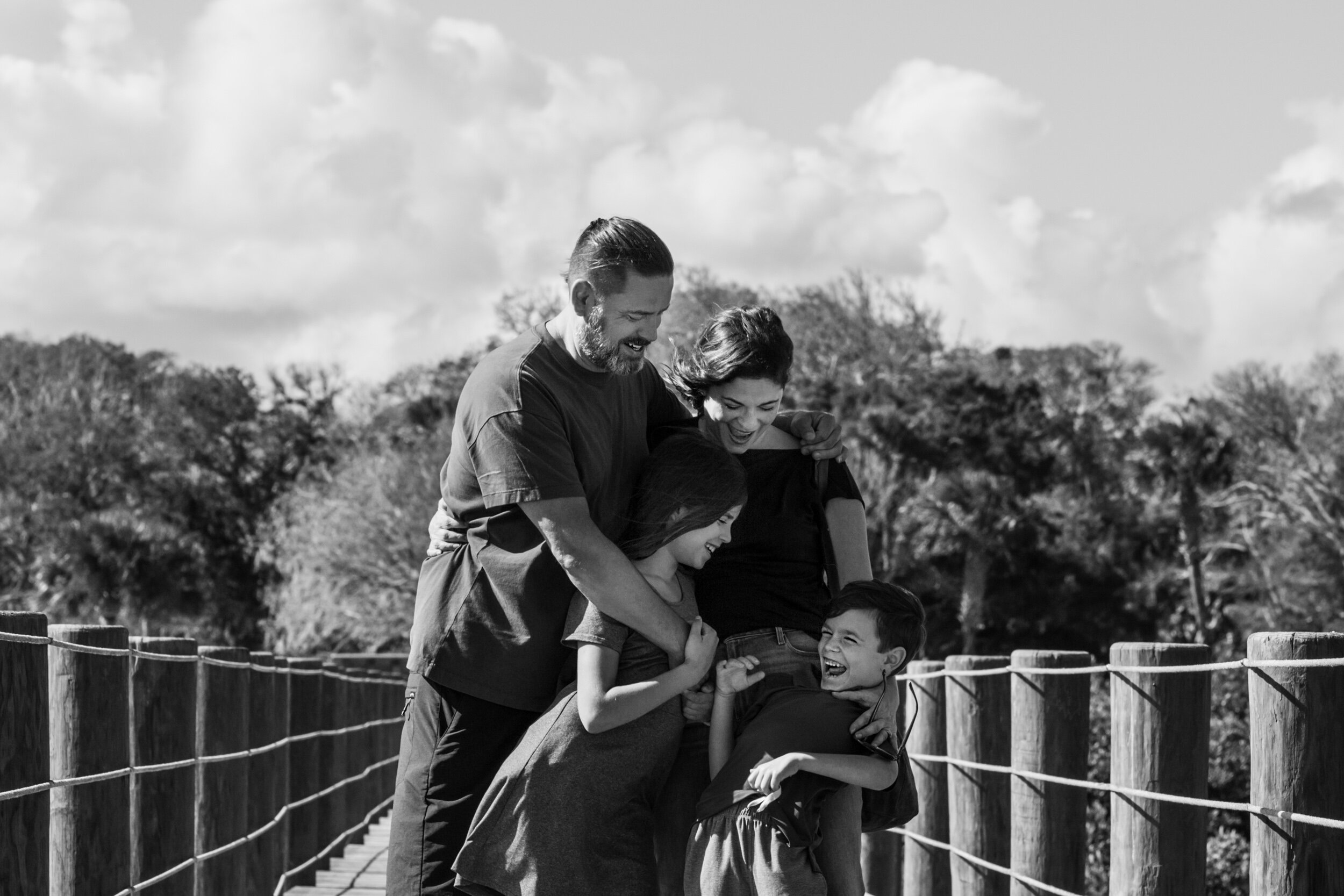 family laughing on a dock in st. augustine