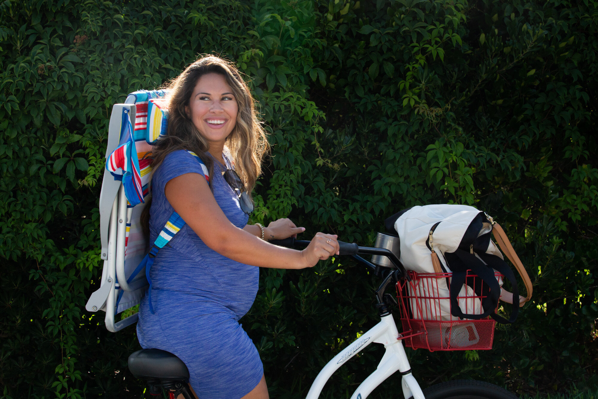 pregnant mom riding a bike in jacksonville beach