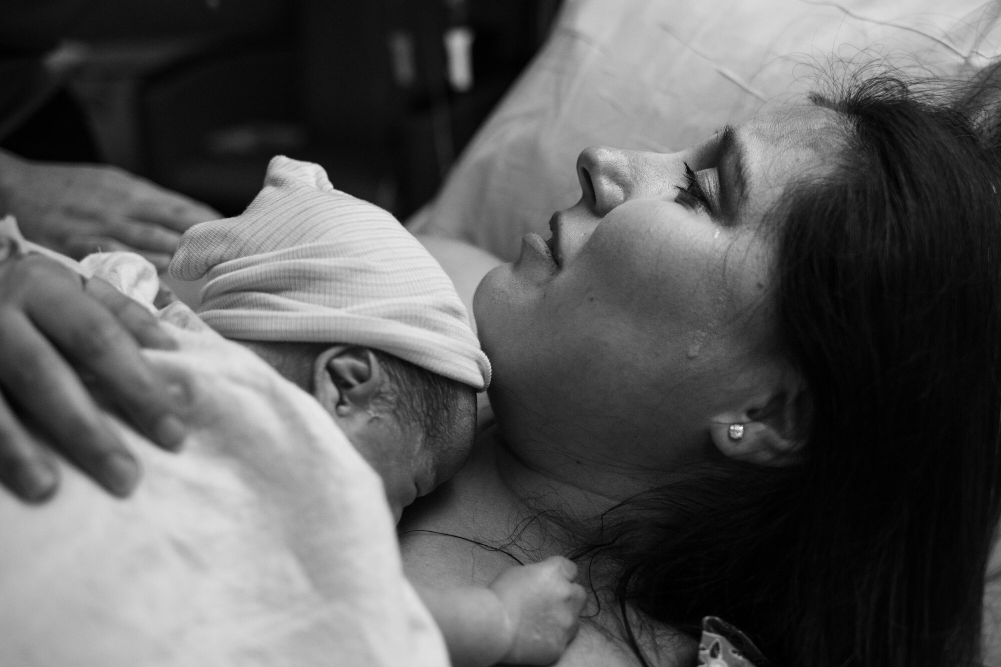 new mom crying just after the birth of her son