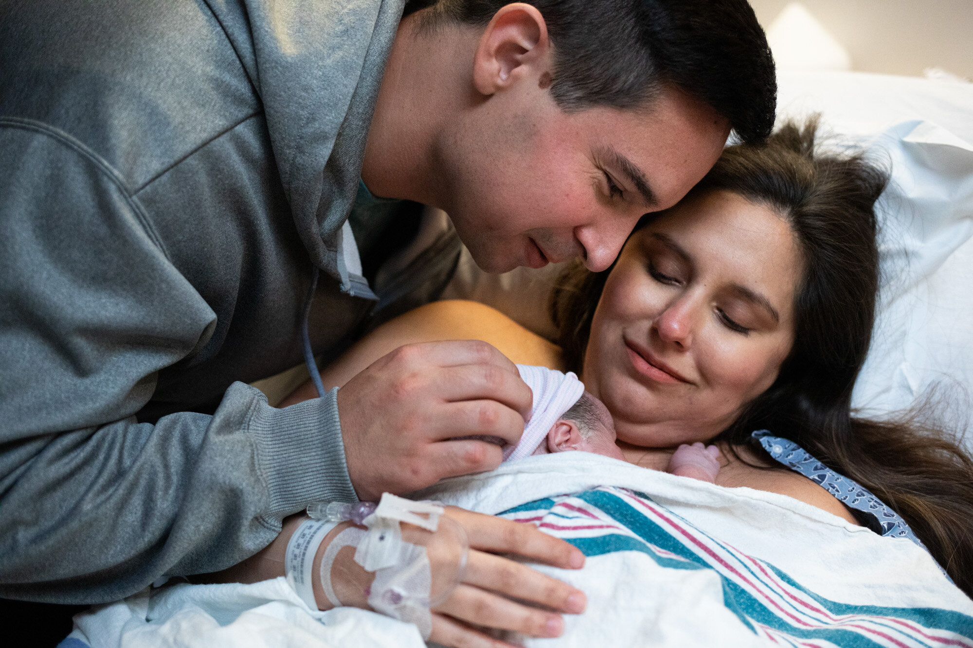 jacksonville parents admiring their newborn baby boy