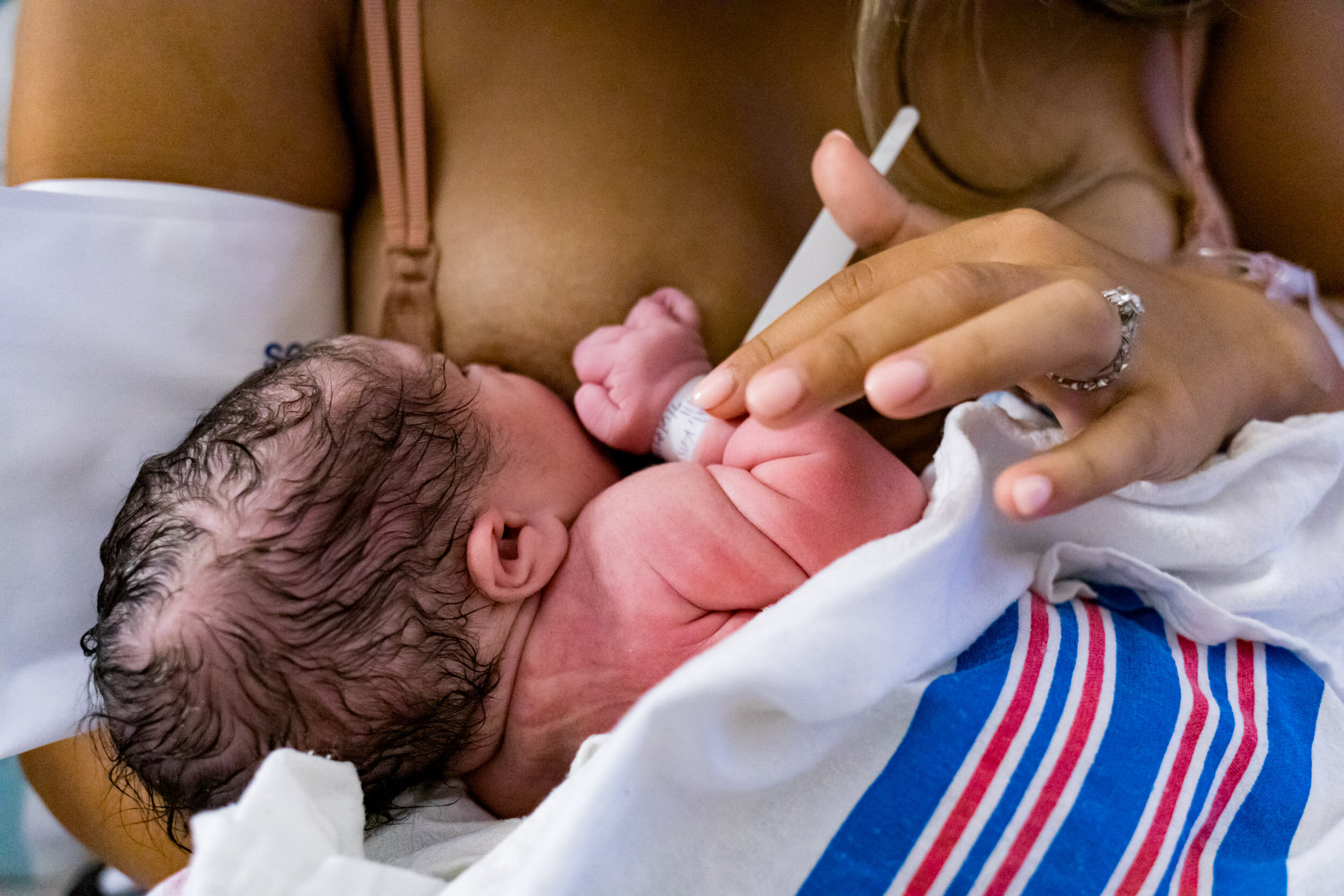 newborn baby girl nursing
