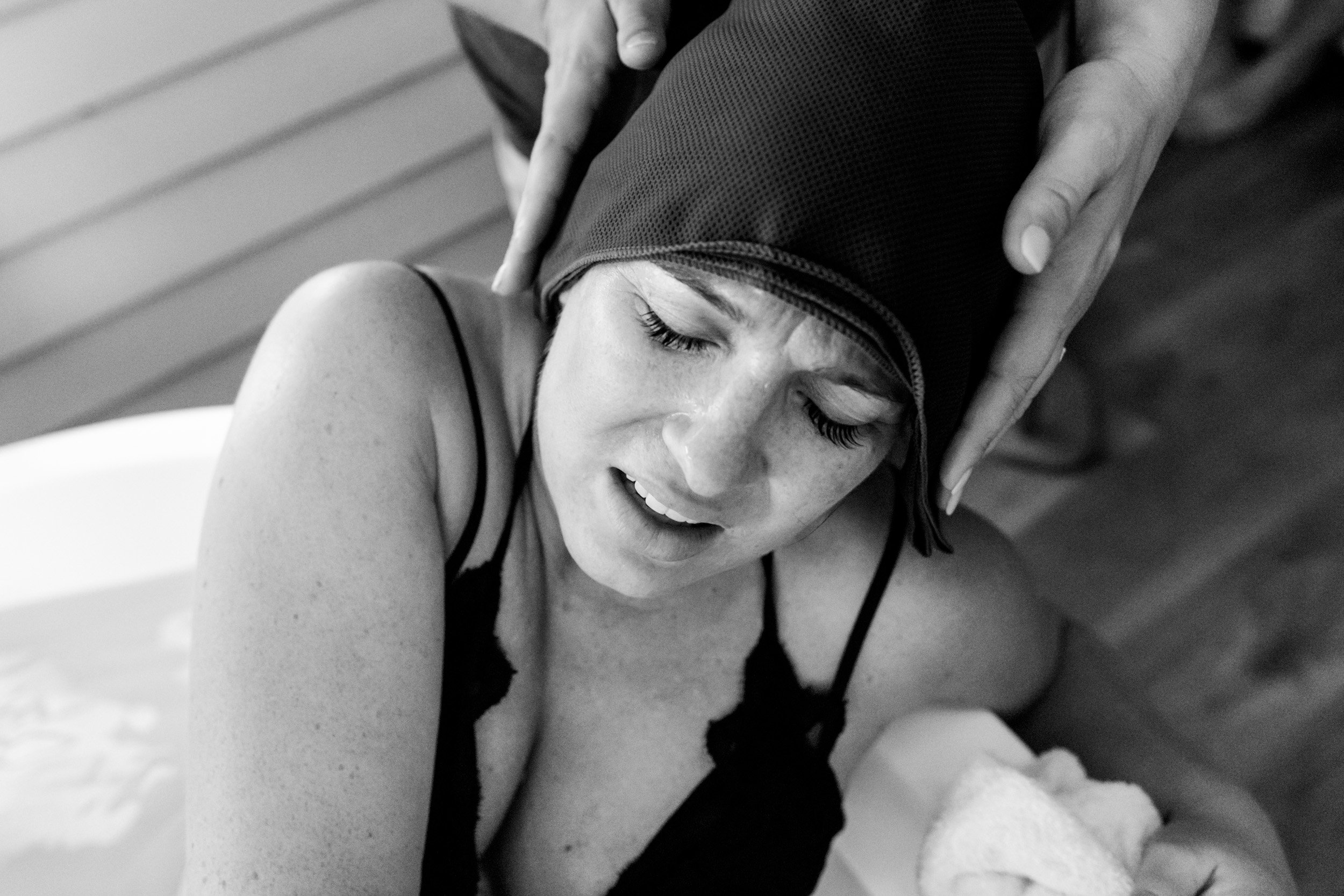 doula holding birth mom's head during a contraction