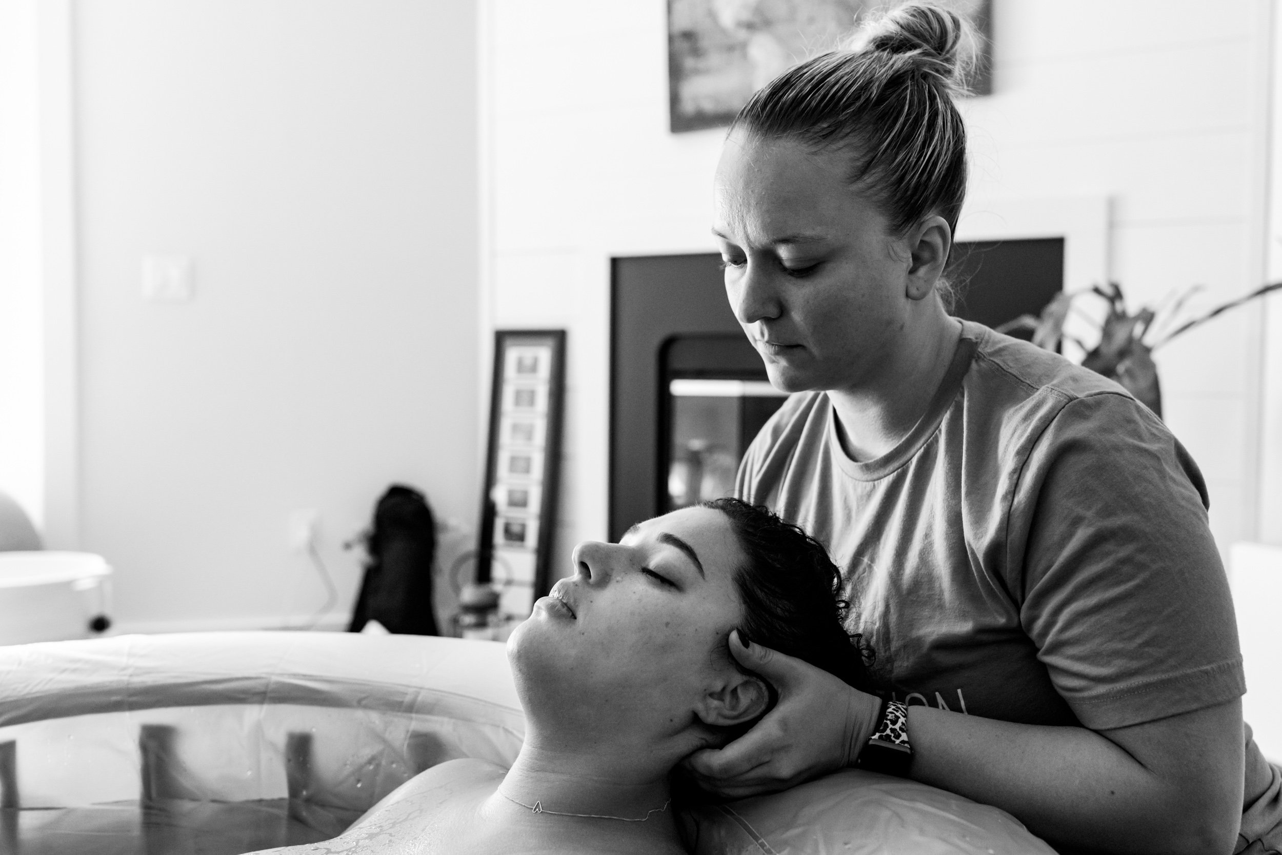 chiropractor adjusting neck for birth mom