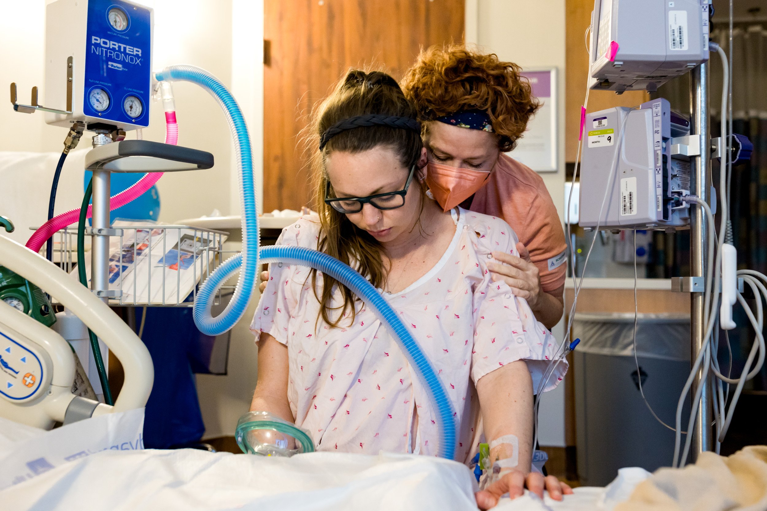 doula comforting mom in labor