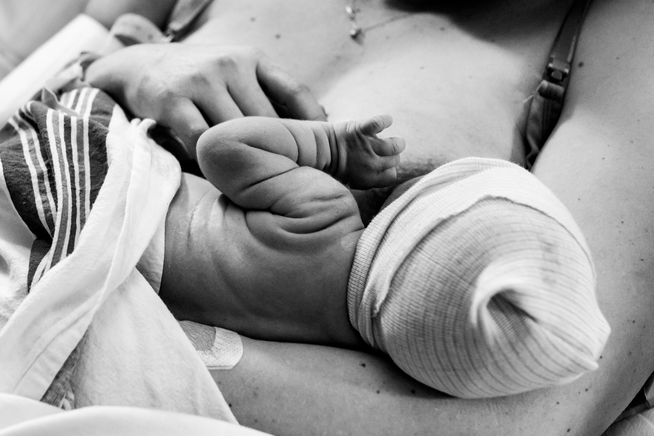 black and white photo showing textural details of newborn baby