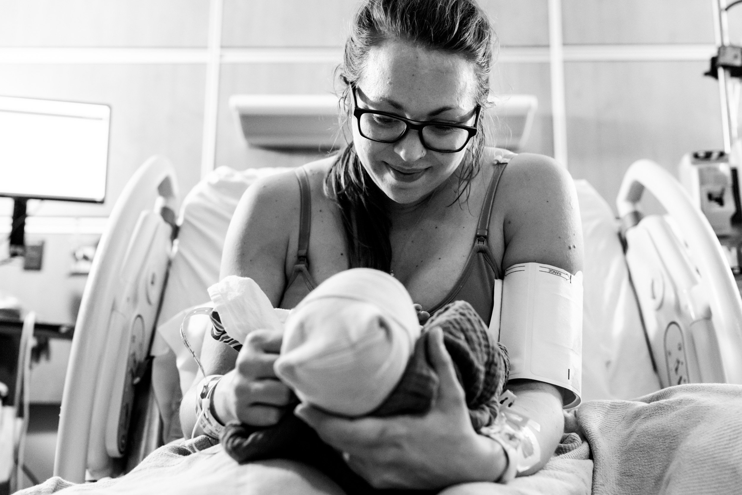 jacksonville mom smiling at her newborn daughter