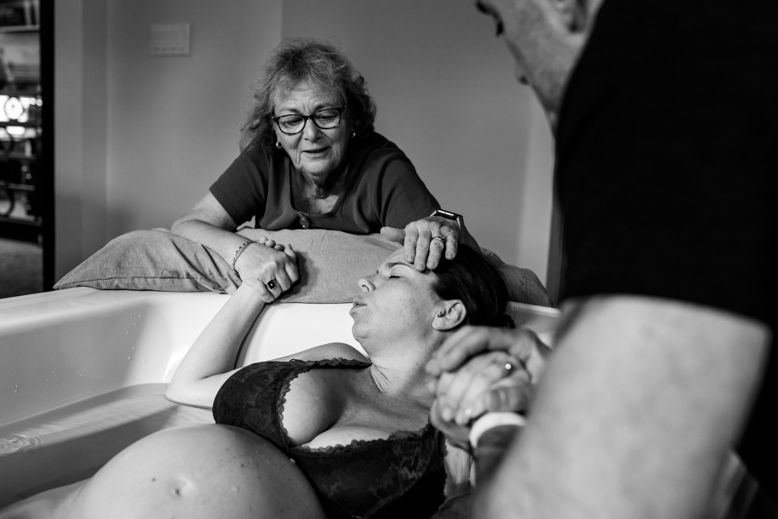 mother supporting her daughter in labor