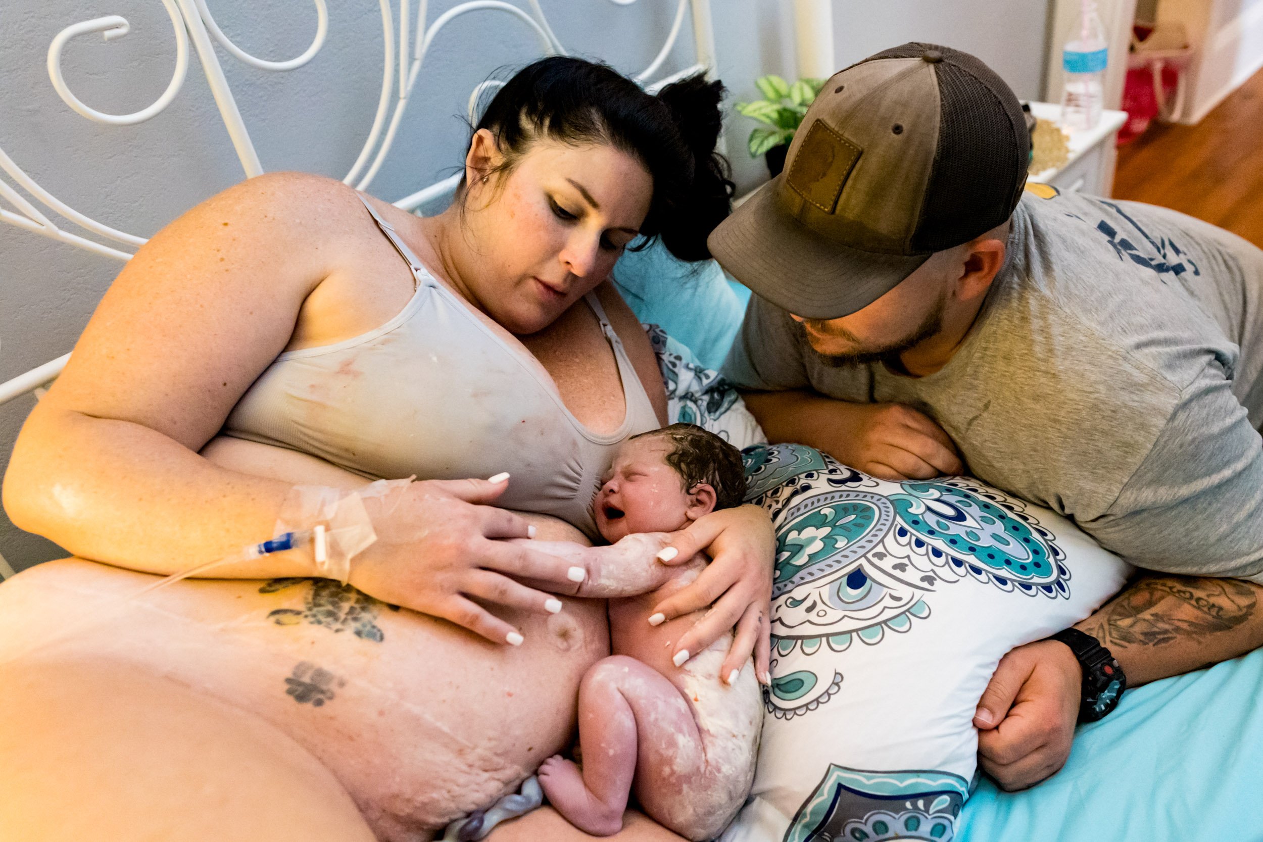 jacksonville parents admiring their baby girl just after birth