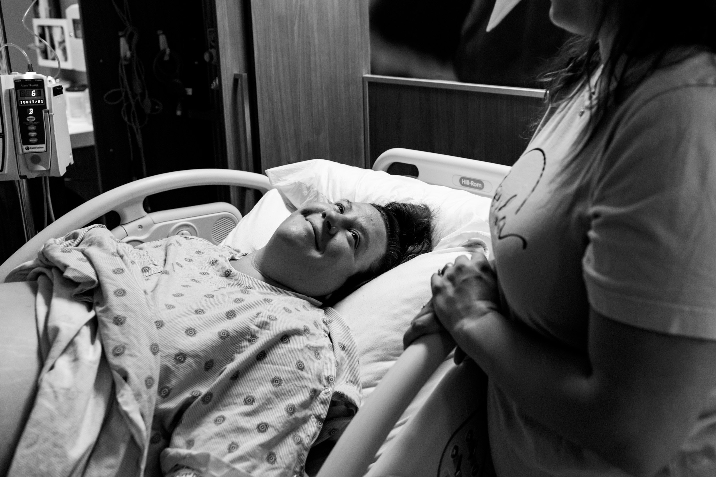 pregnant mom looking at her husband while in labor