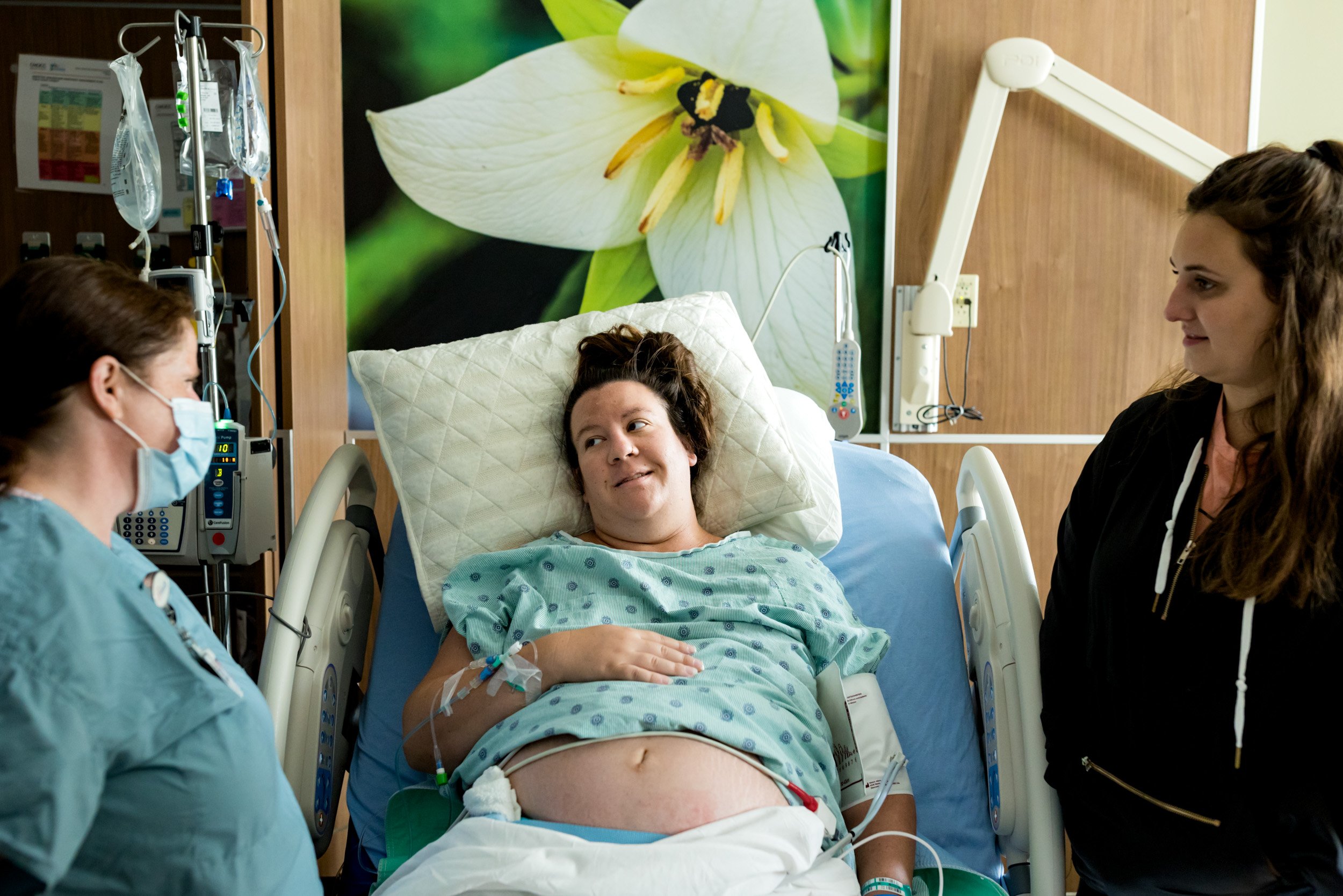 pregnant mom talking with midwife at the hospital