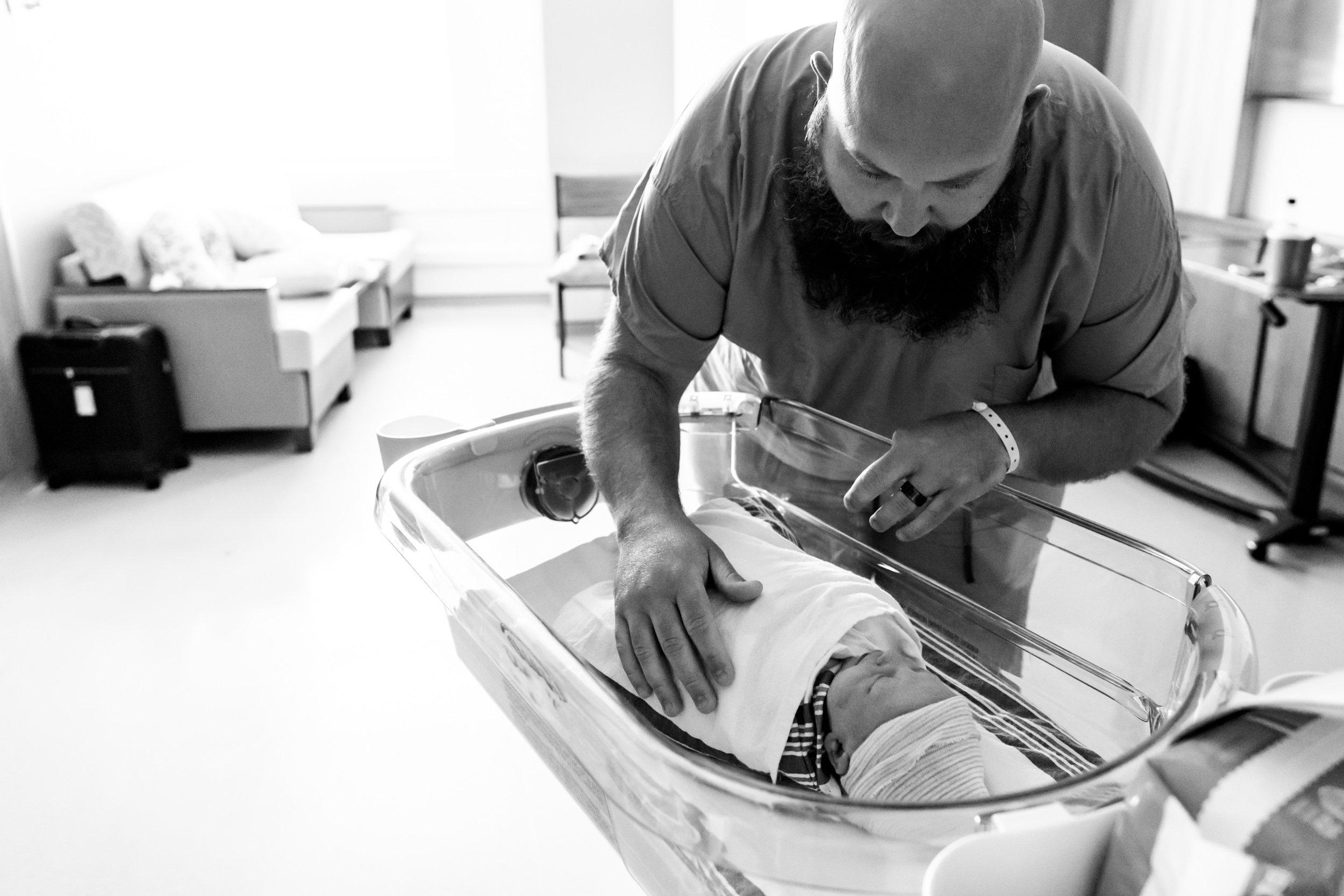 dad comforting his newborn baby girl