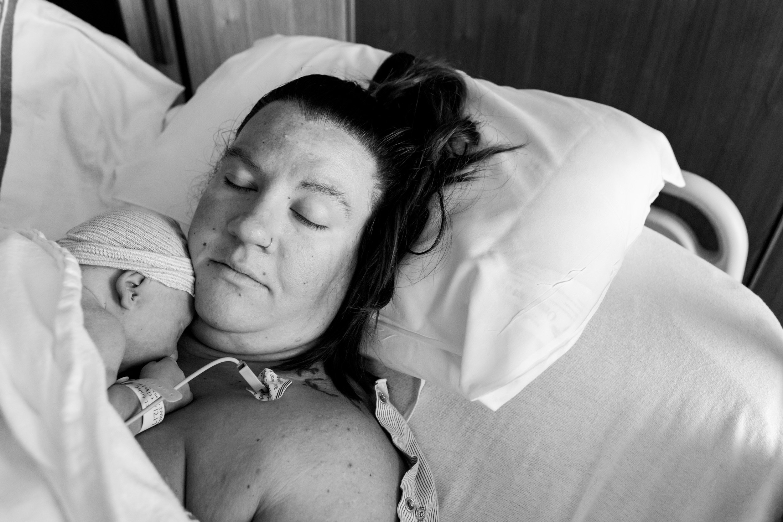 birth mom resting with baby on her chest