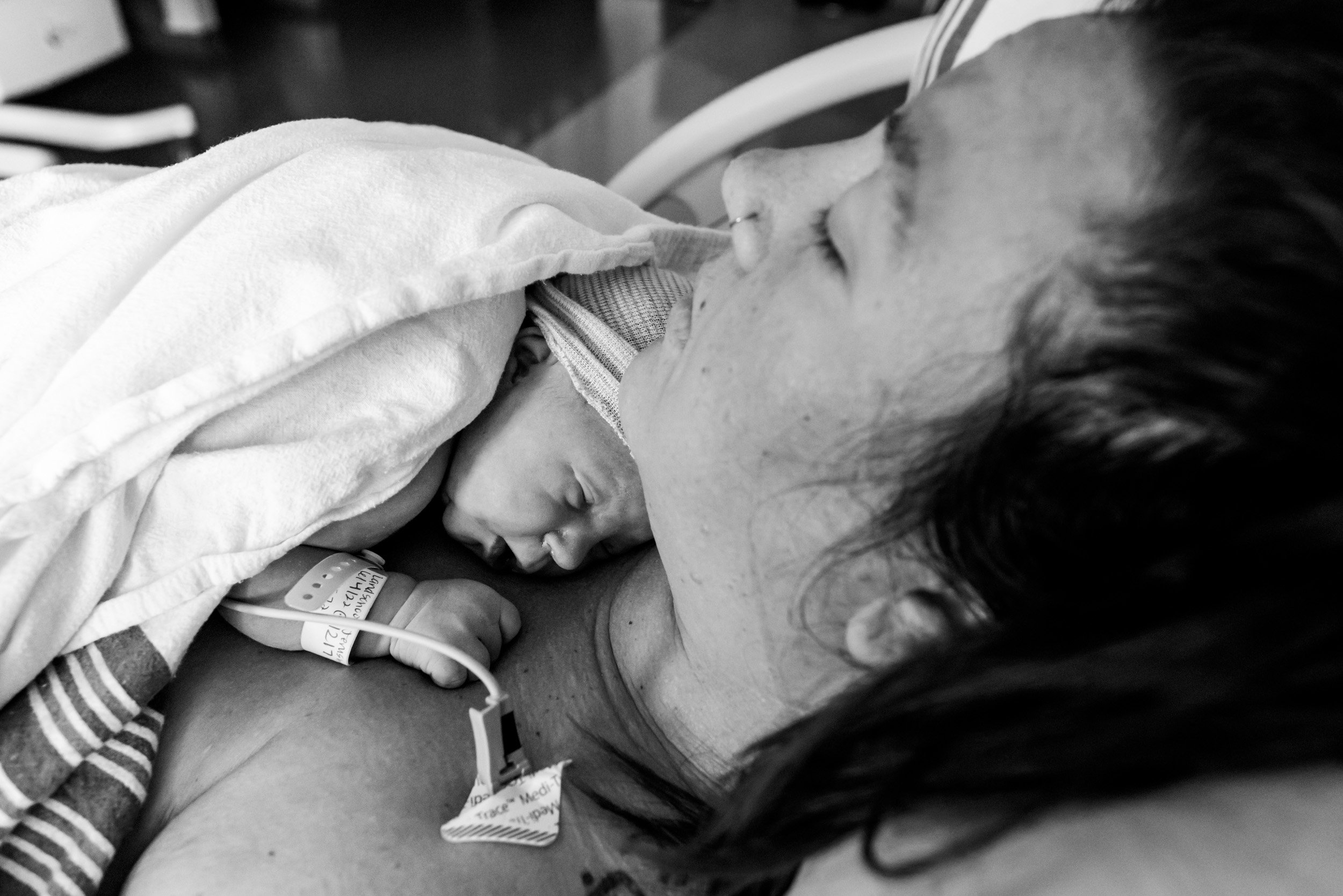 mom holding baby on her chest just after birth