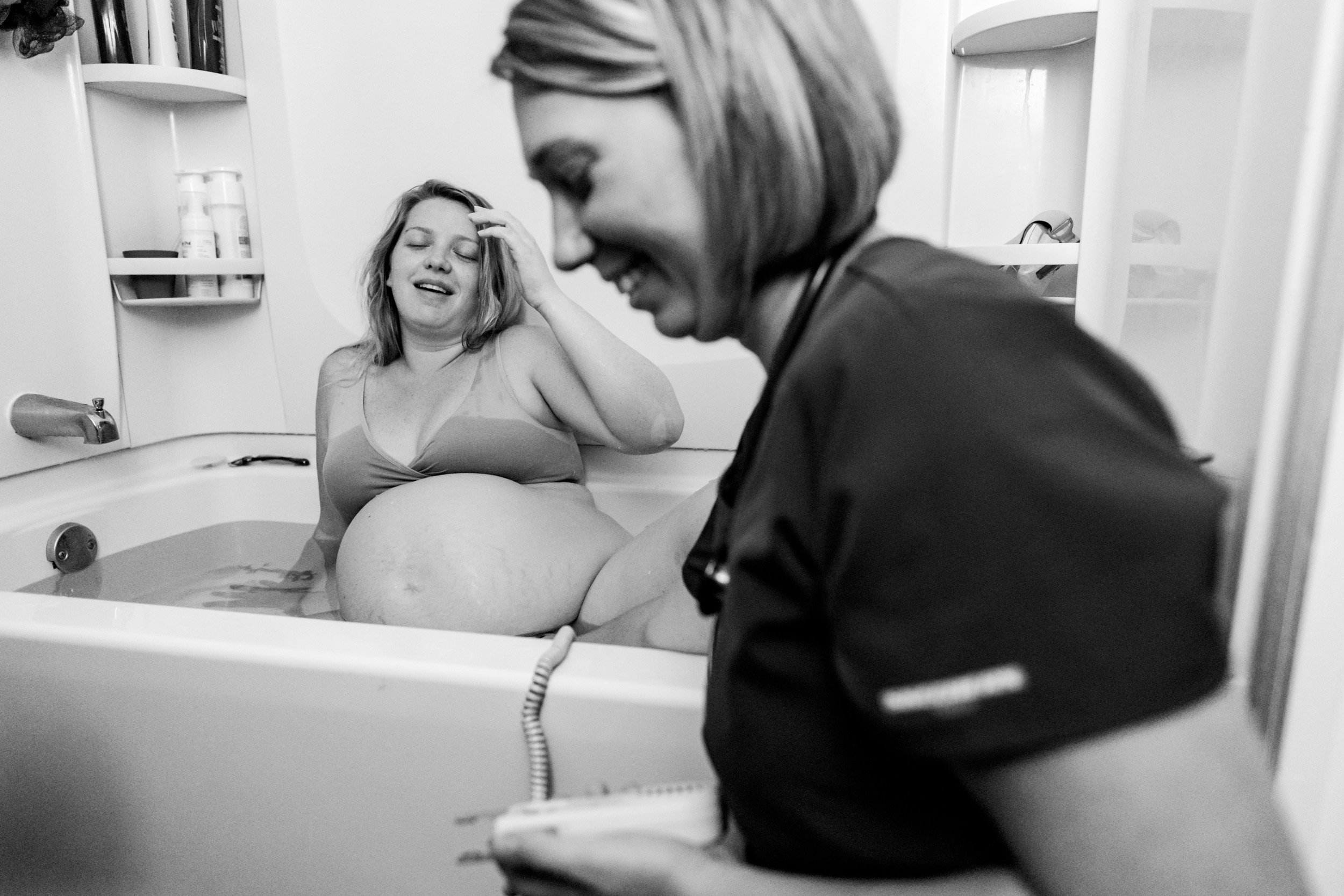 midwife laughing with birth mom