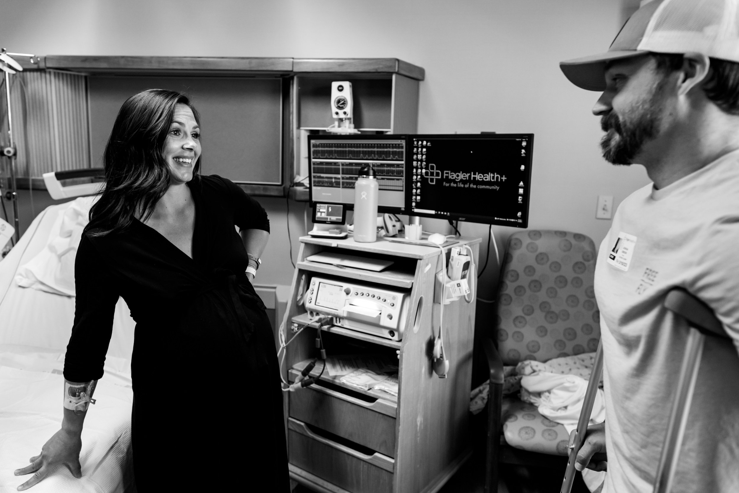 mom in labor smiling at husband in between contractions
