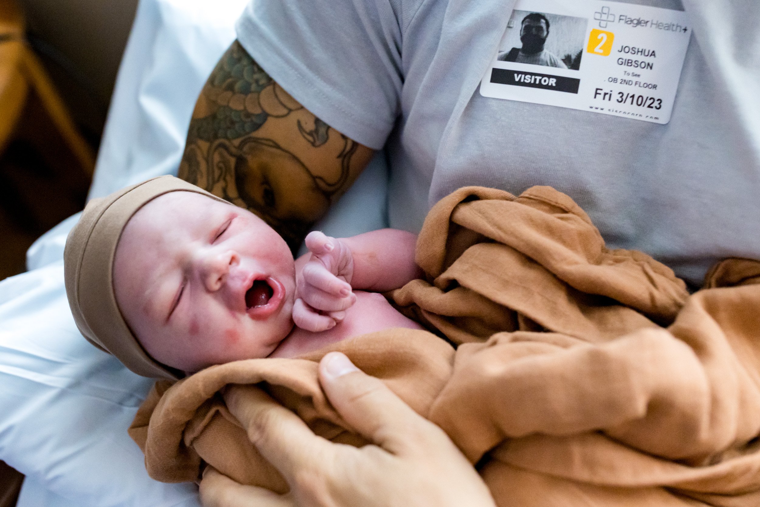 newborn baby boy being held by dad