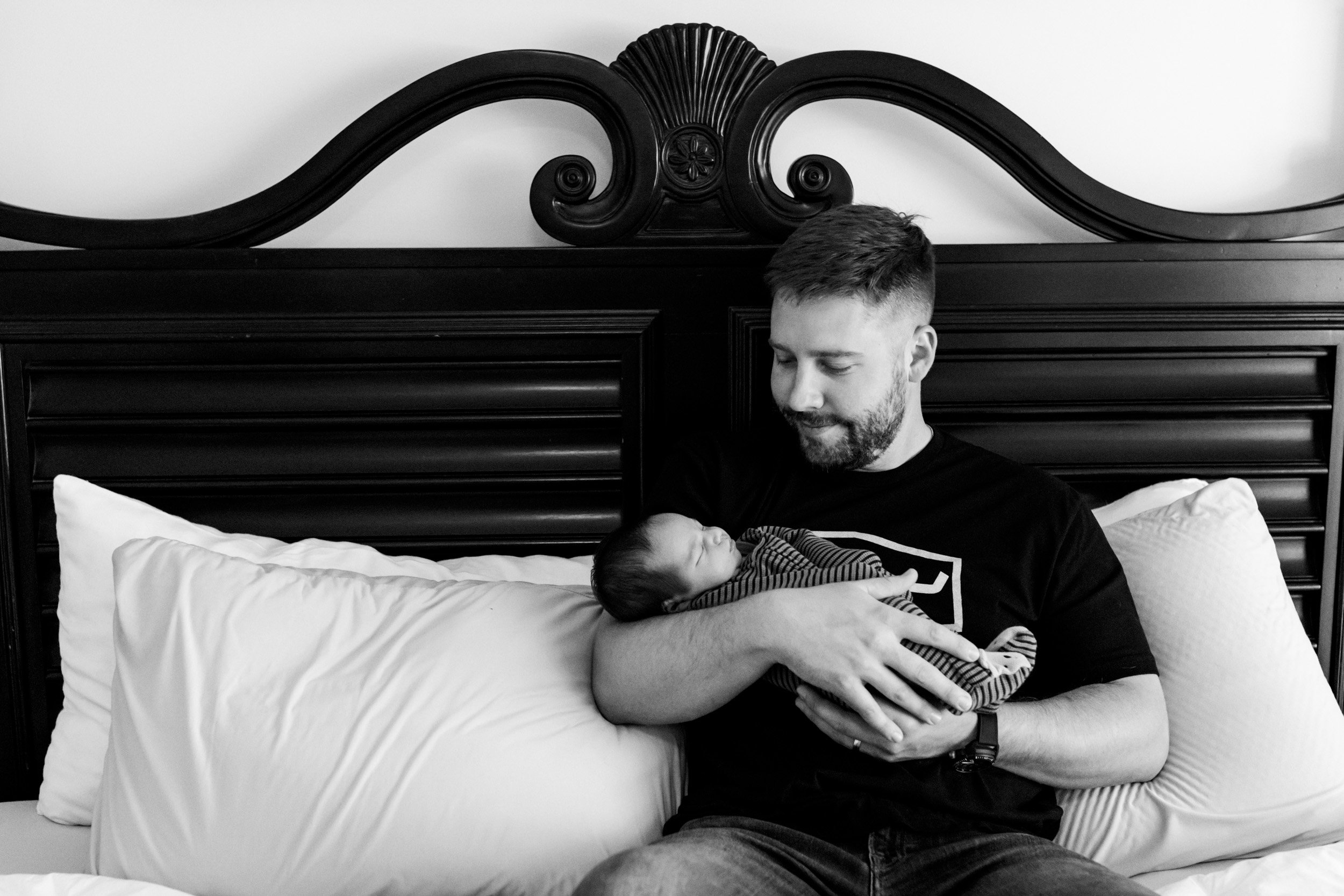jacksonville dad holding his newborn baby boy