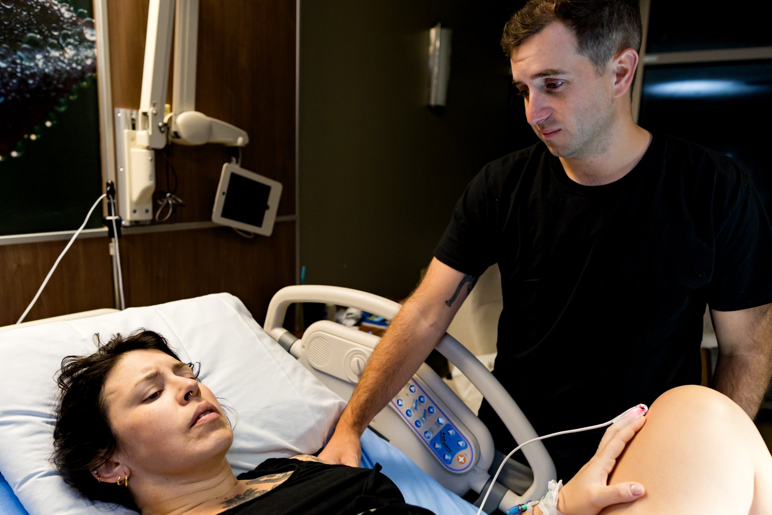 husband comforting his wife during labor