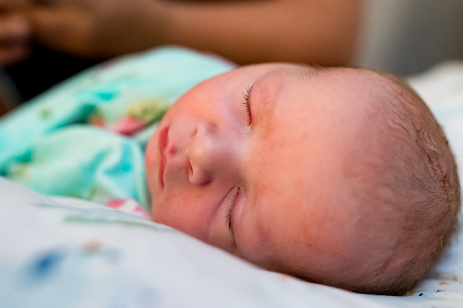 close up of newborn baby girl's face