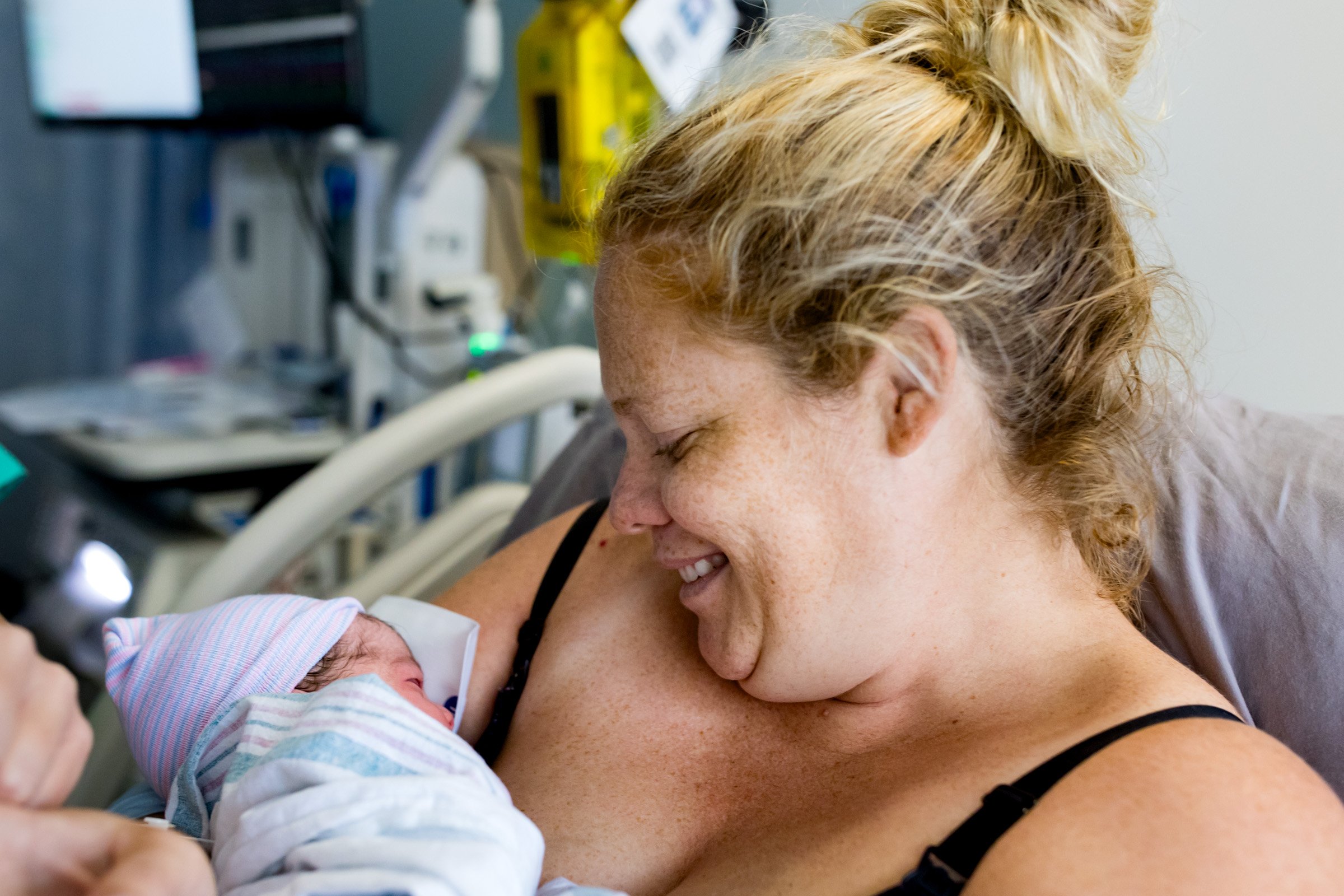 jacksonville mom smiling at her baby just after birth
