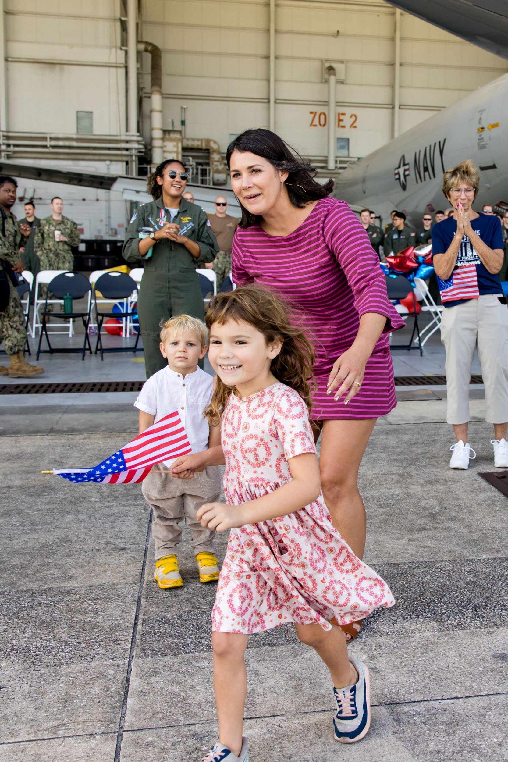 little girl running toward dad who just got off the plane