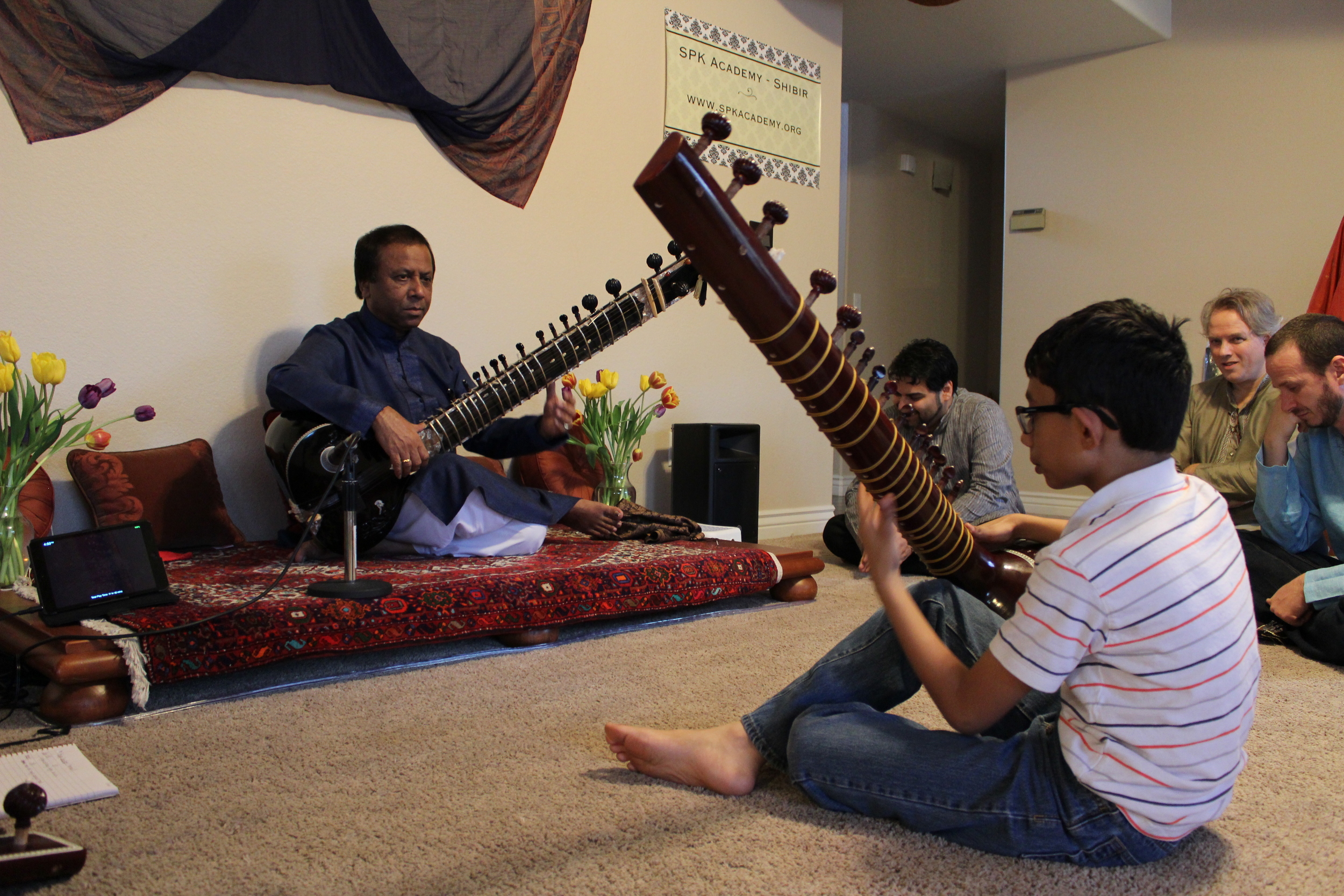 Ustad Shahid Parvez Khan teaching sitar to one of our youngest students, Vishwesh.