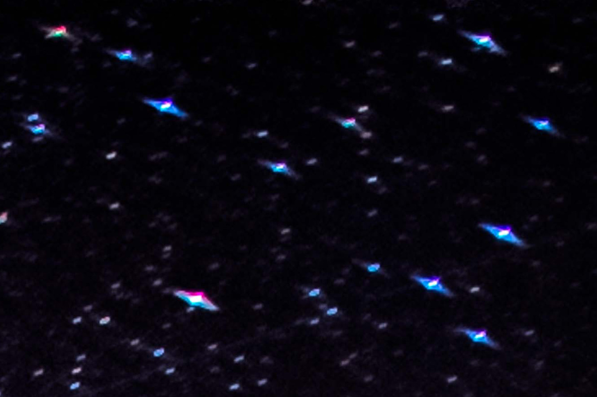 Coma and Chromatic Aberration in a Starry Night Image