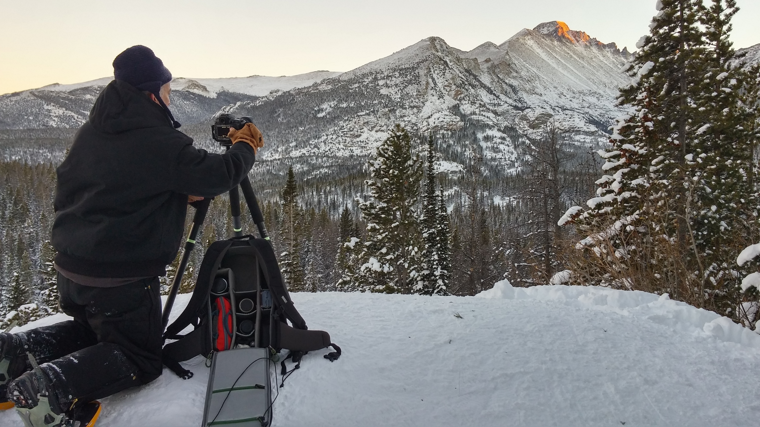 Mike sets up for a winter photograph with Longs Peak in Rocky Mountain National Park, Colorado while testing the MindShift Backlight 26L.