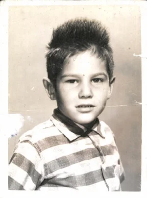 Kenny (Robby) when Charlie and Millie adopted him