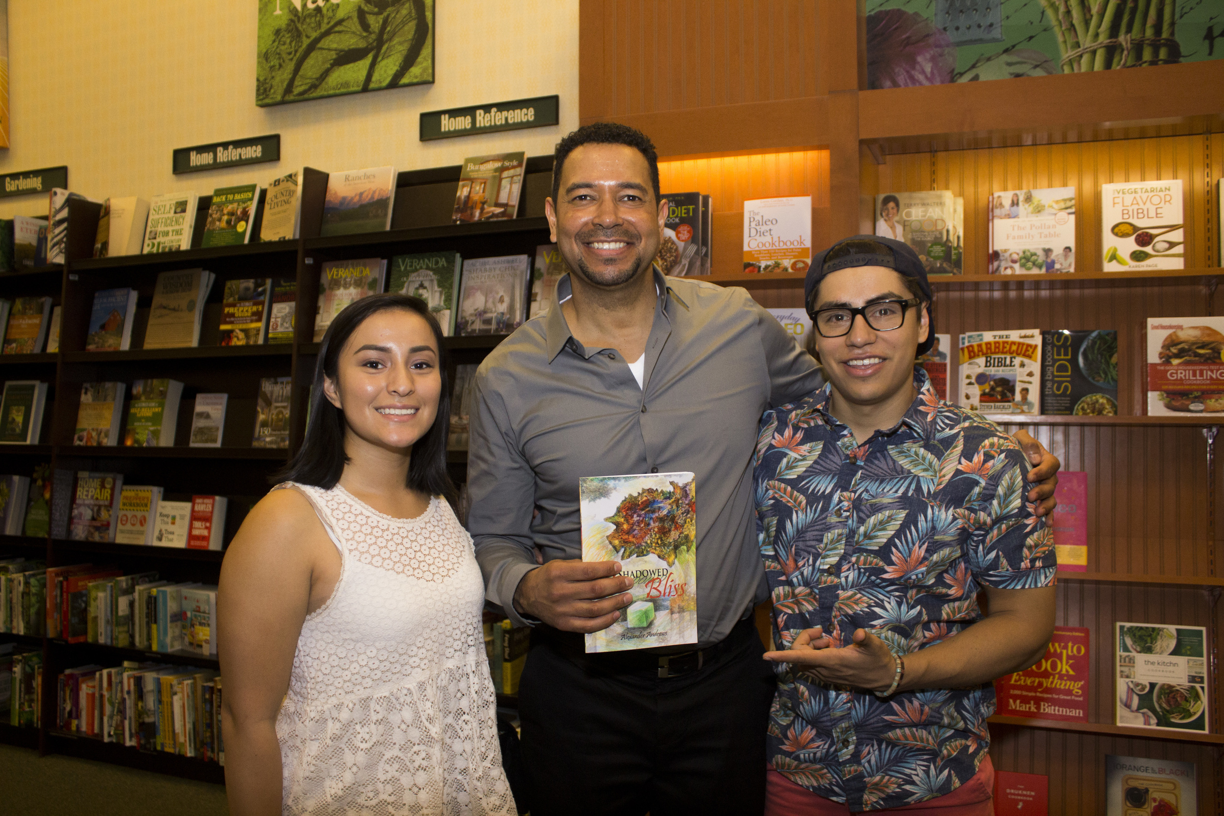 Professor and author Alexander Andrews takes a picture with some of his former students. 