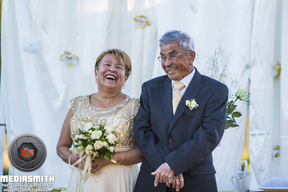 Anniversary Photography: Couple Laughing at the "Altar"