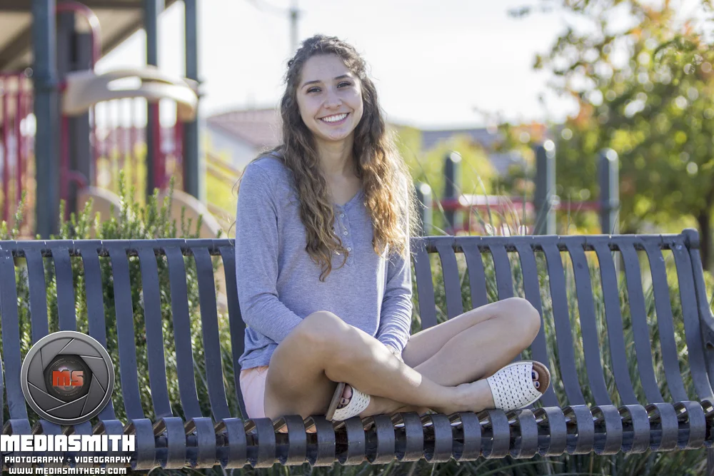 High_School_Graduation_Portraits_Photography_Buckeye_AZ_Smiling_on_Chair