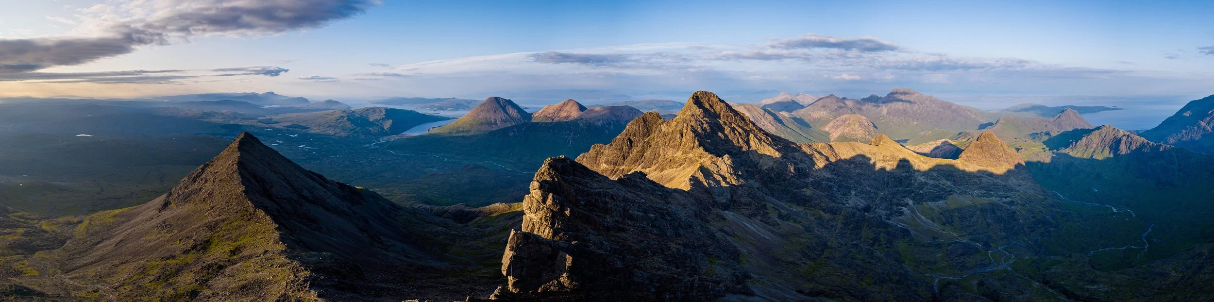 Aerial photograph of Am Basteir, Basteir Tooth and Sgùrr na Gillean on the Cuillin Ridge, Isle of Skye, Scotland, at sunset
