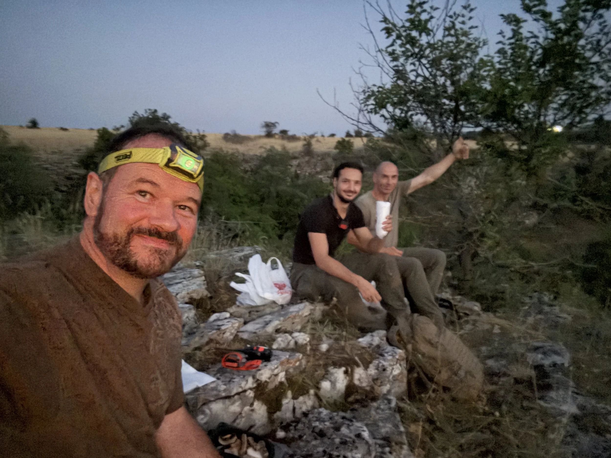 Kirk Watson with survival experts Martin and Momchil at 4:30 a.m., waiting for sunrise during filming of Naked and Afraid in Bulgaria for Discovery Channel.