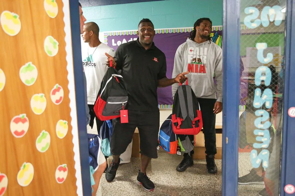 Charlotte Business Journal Covers Thomas Davis' Annual Back Pack Drive Serving 650+ Students