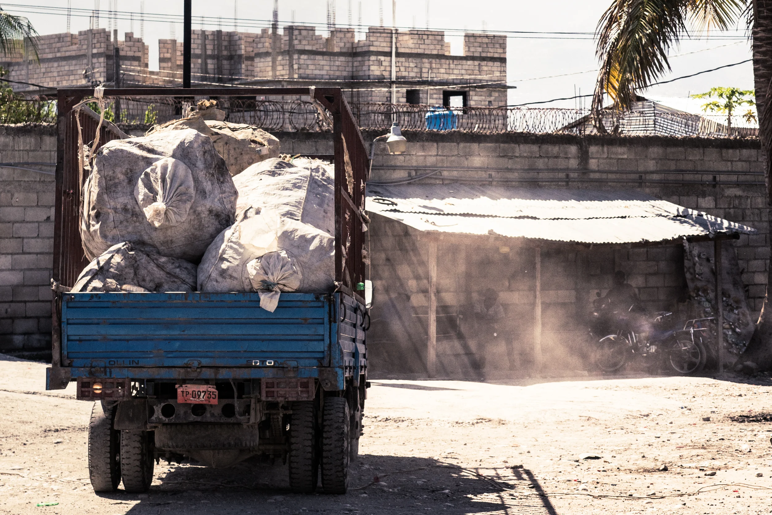 Delivery truck with super sacks of plastic. 