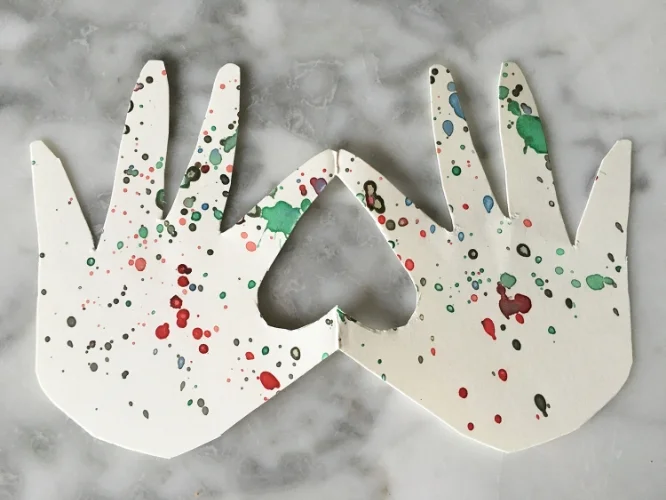 This is a Valentine’s card I made with Luca that I keep one on my desk. First we splattered paint on thick paper, folded it in half, traced his hands and cut it out. I’m not crafty but I love how it came out!