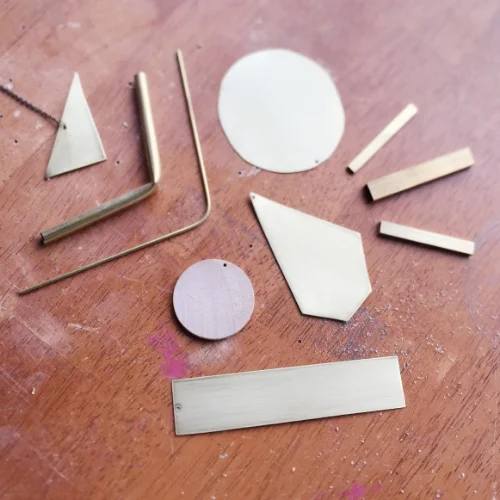  "An arranging of brass pieces. This is how I get my ideas; from arranging and rearranging until something comes up."