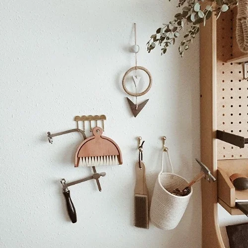Rebel and Quill hooks adorn the studio wall. 