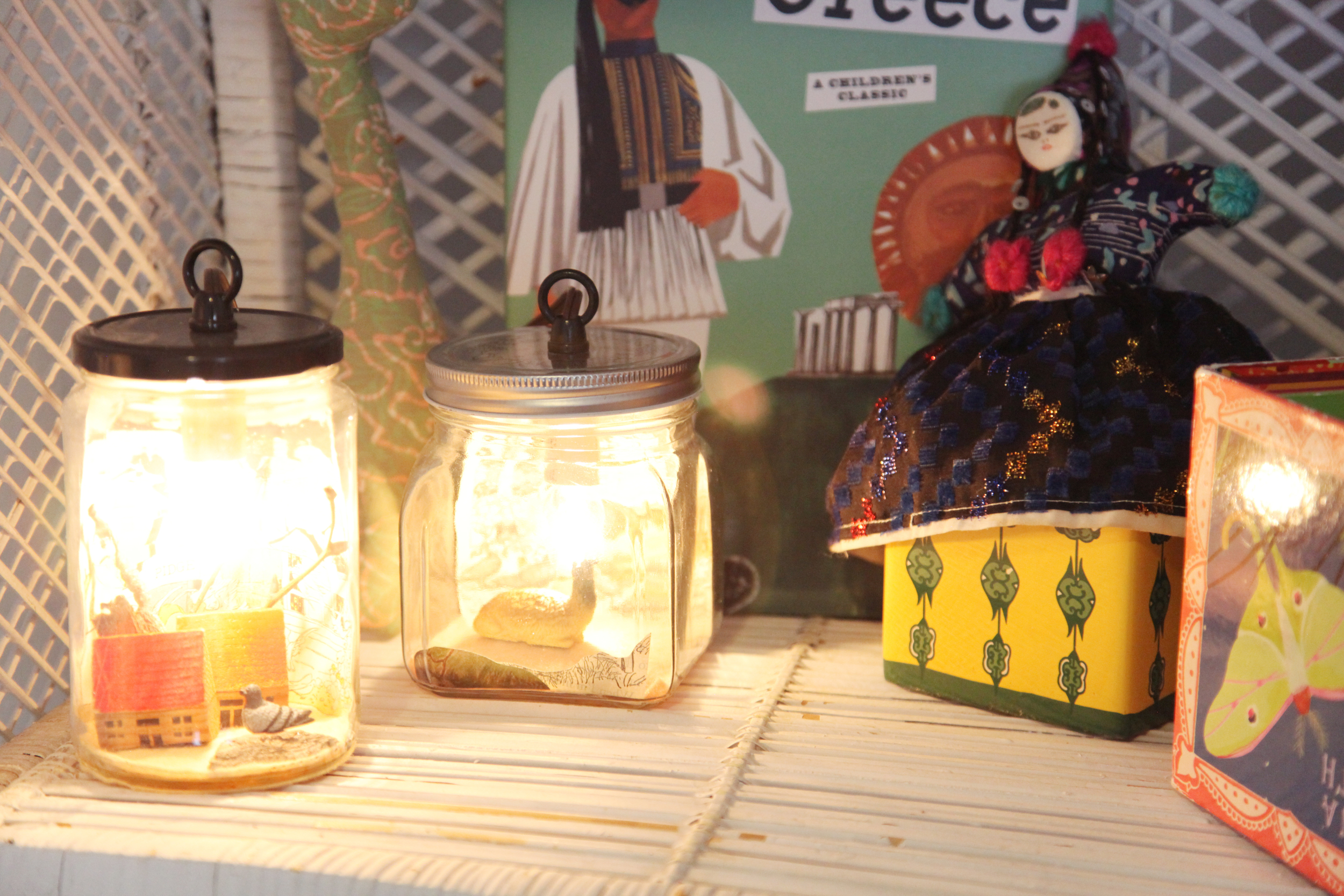  Little diorama lanterns by   Small Home .  Dana met the creator at the Williamsburg holiday market years ago and had her make a custom lamp with a pigeon in it when she was pregnant with Georgia, who's nickname was "Pidge" in utero.&nbsp; 