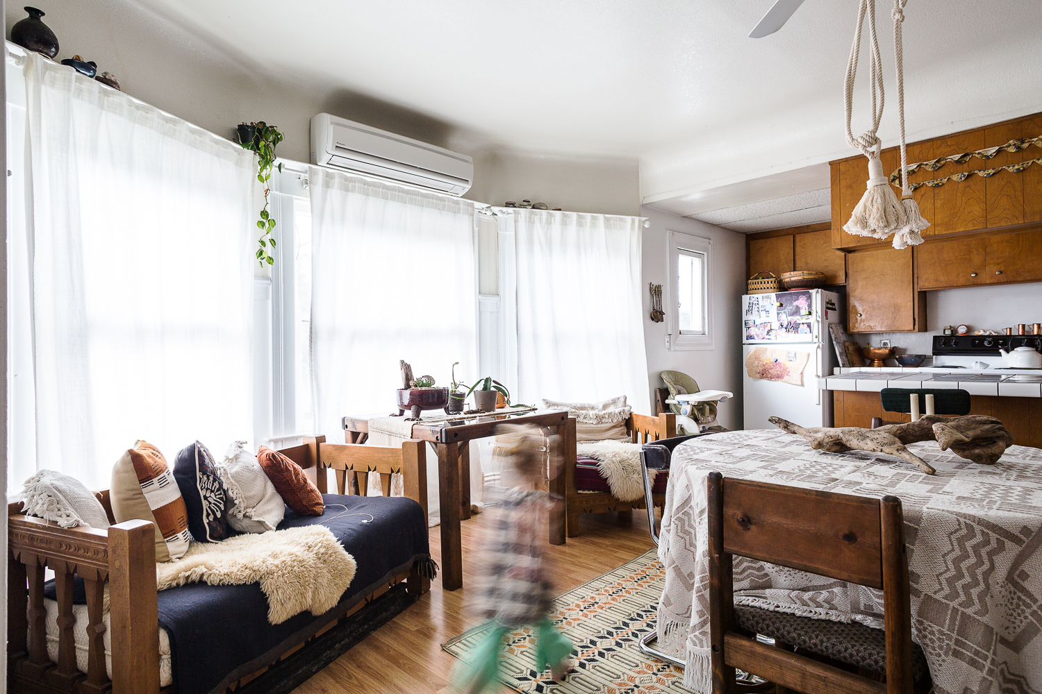  The exposed kitchen is ideal for entertaining and family time. Her eclectic sense of comfort is perfection.&nbsp; 