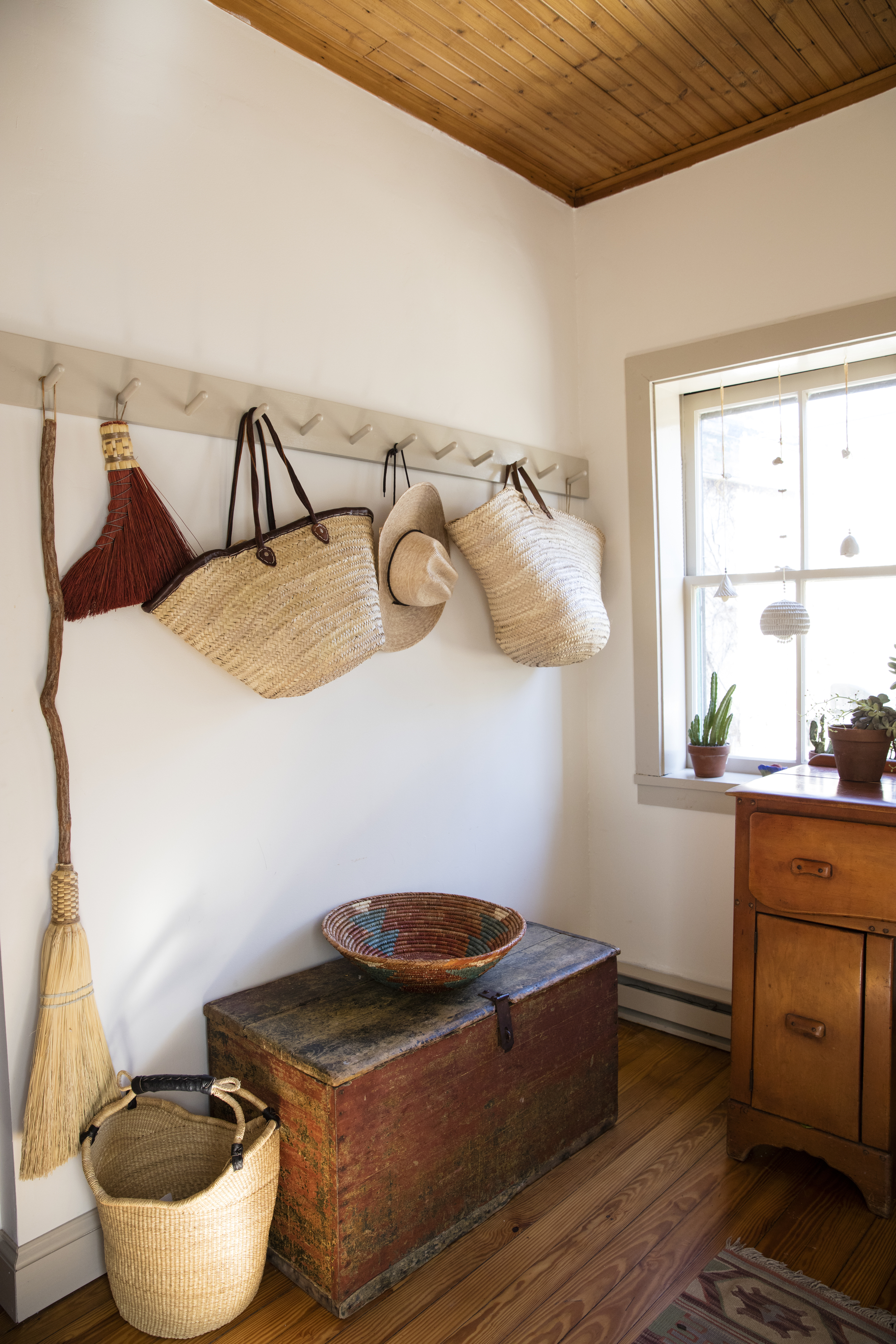  Pretty brooms and basket-storage. 