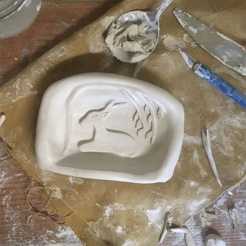 Sculpting the fireplace.