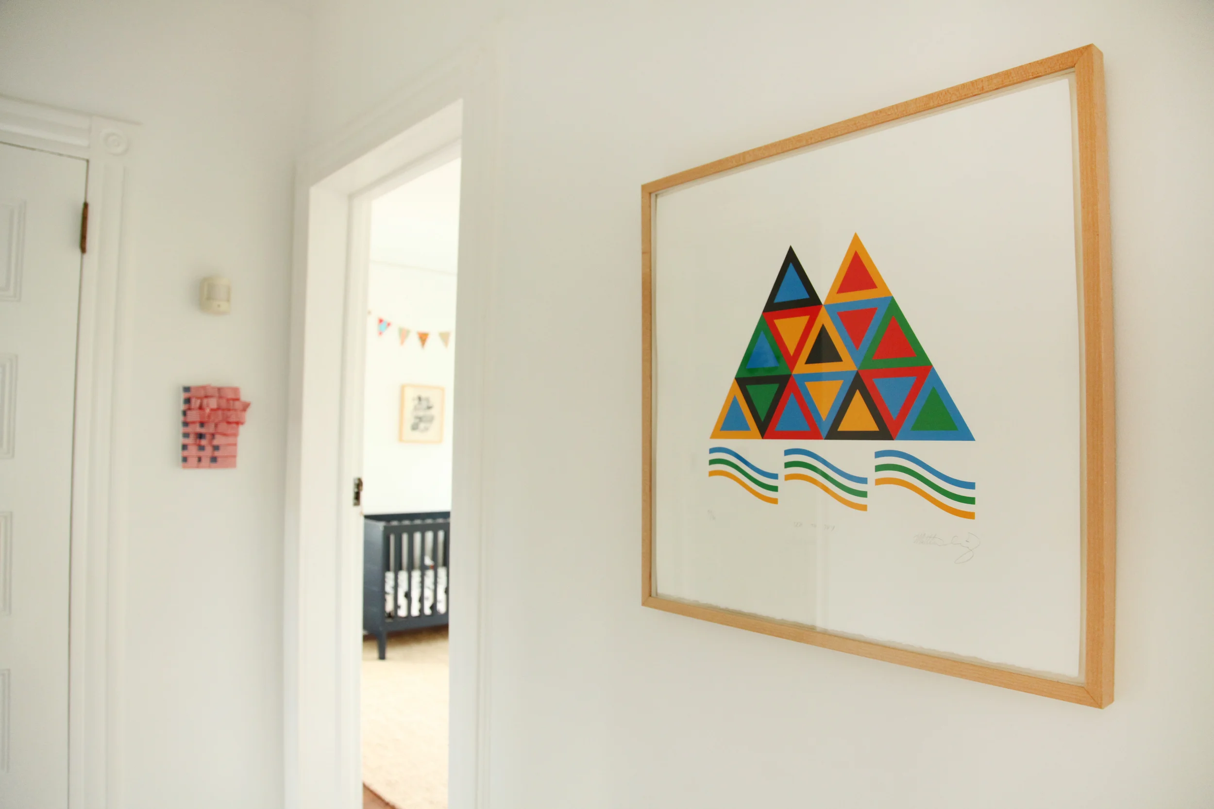 Triangle piece by Matt Irving. Danielle made the American flag collage that hangs in the back.