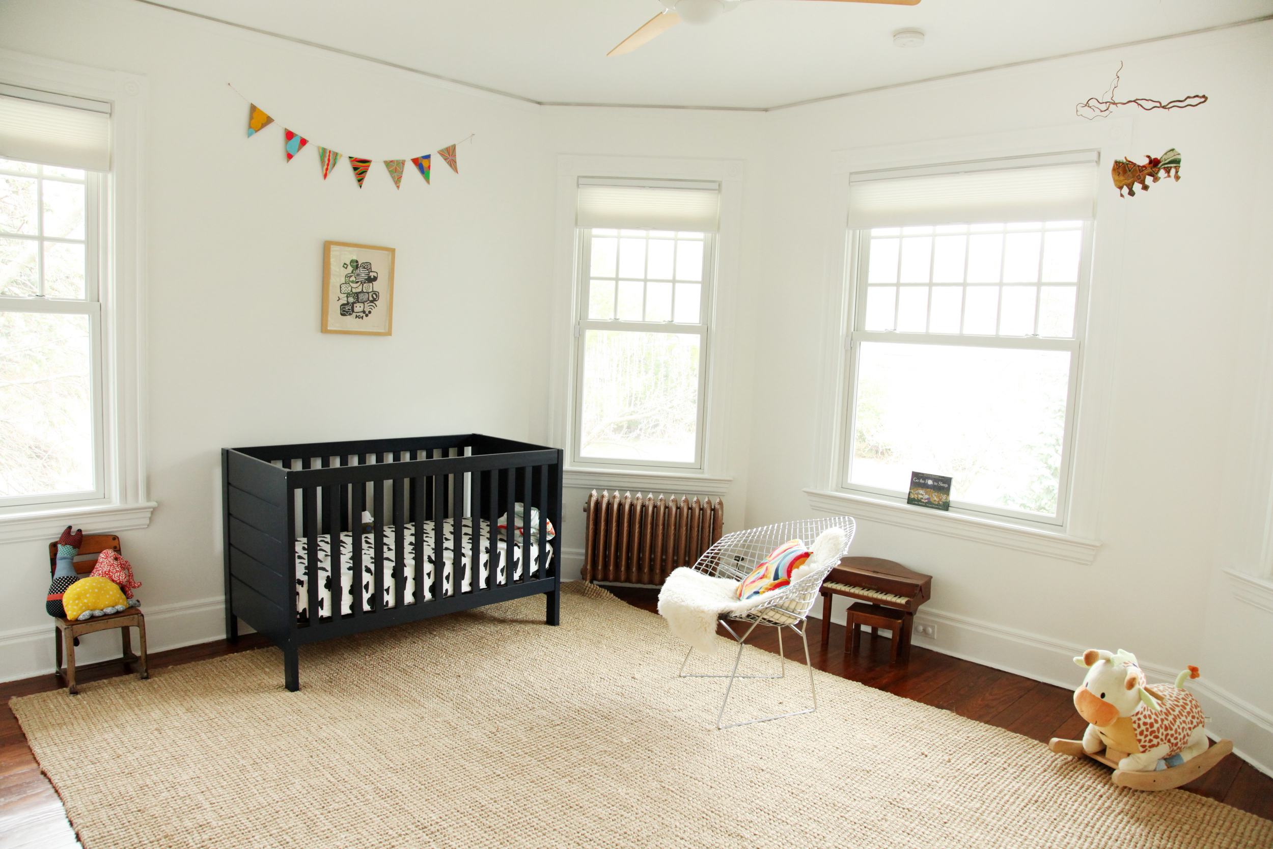   "I found the vintage school chair in my grandparents' attic along with the vintage children’s Schoenhut piano that has wooden keys!! &nbsp;The stuffed animals on the chair are made by Thomas and I. &nbsp; Land of Nod &nbsp;bedding. The crib is actu