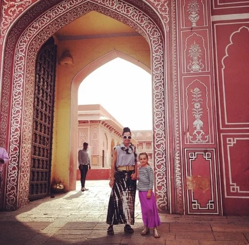Traveling with her mini-me.