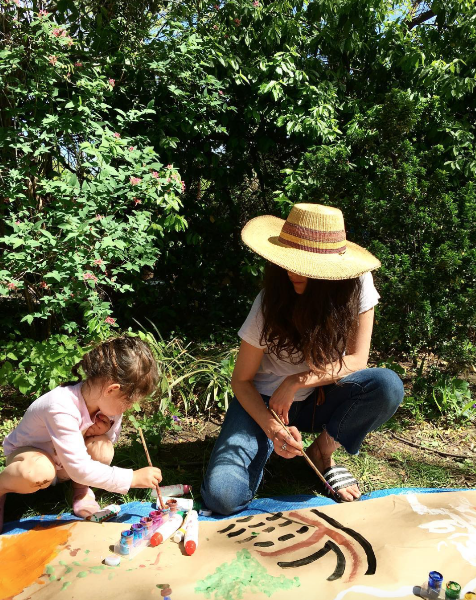 Lisa and her daughter painting in their Brooklyn Garden. 