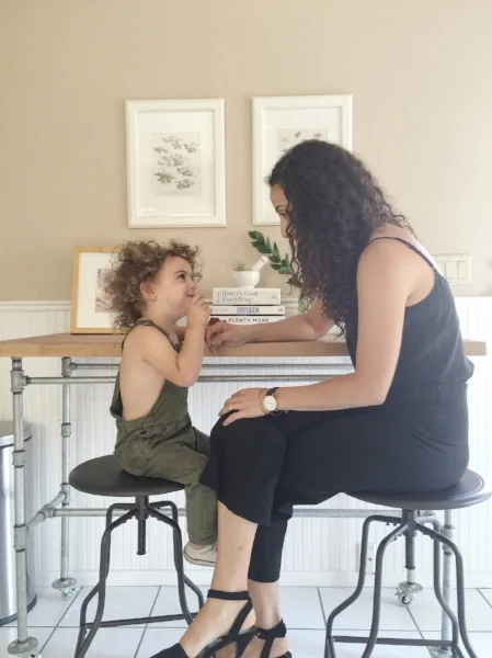 Mama and son get cute in the kitchen.