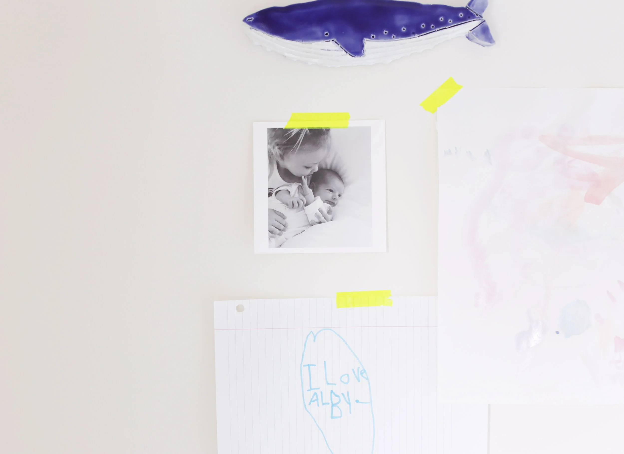  A friendly ceramic   whale   cozies up to sweet memos from big sister, Iris. 