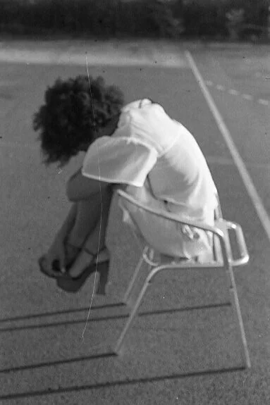 Laurence; resting on a chair.